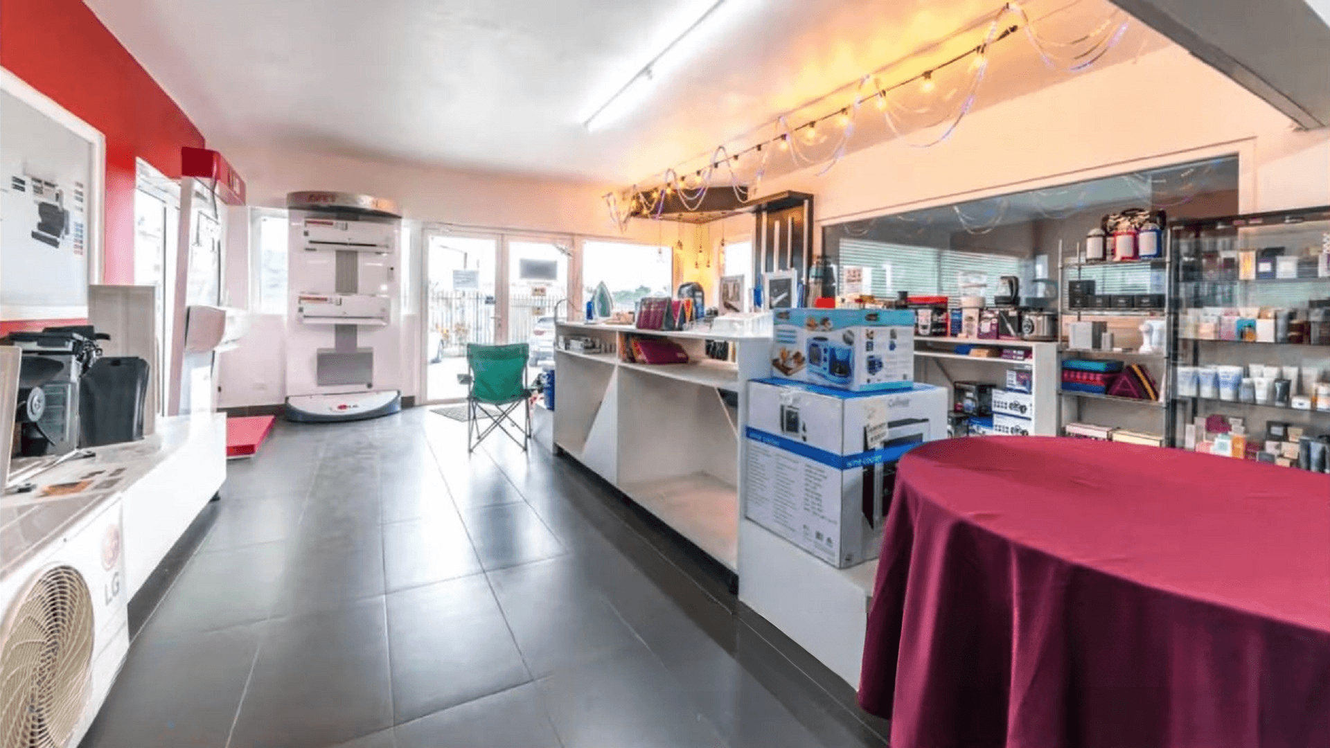Showroom interior at the Commercial Office Space for Rent at Schotlandstraat 77-A Aruba featuring display shelving, counters, and open floor space.