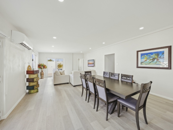 Dining area connected to the open living room at Pos Abao 10 F villa in Noord, Aruba.