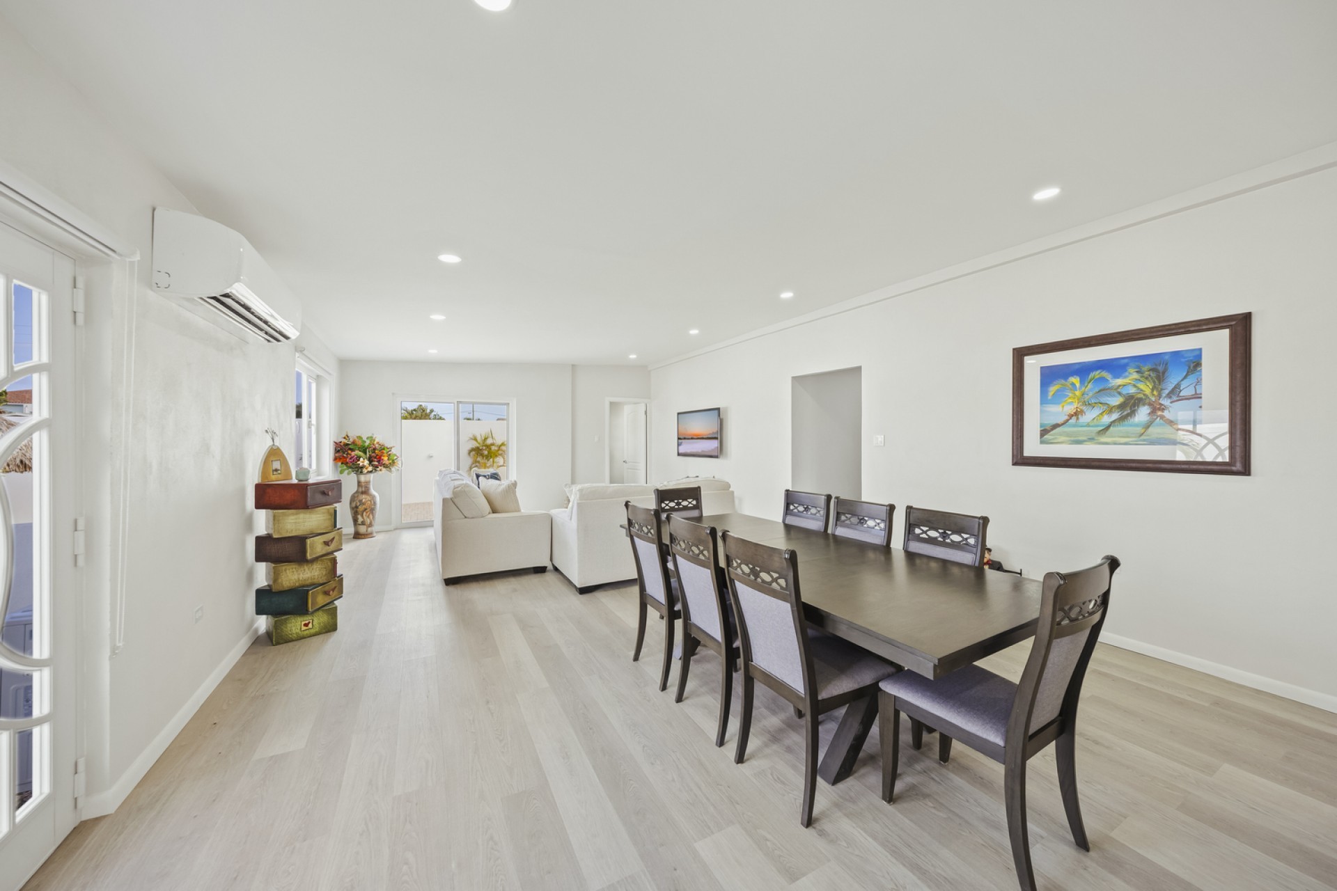 Dining area connected to the open living room at Pos Abao 10 F villa in Noord, Aruba.