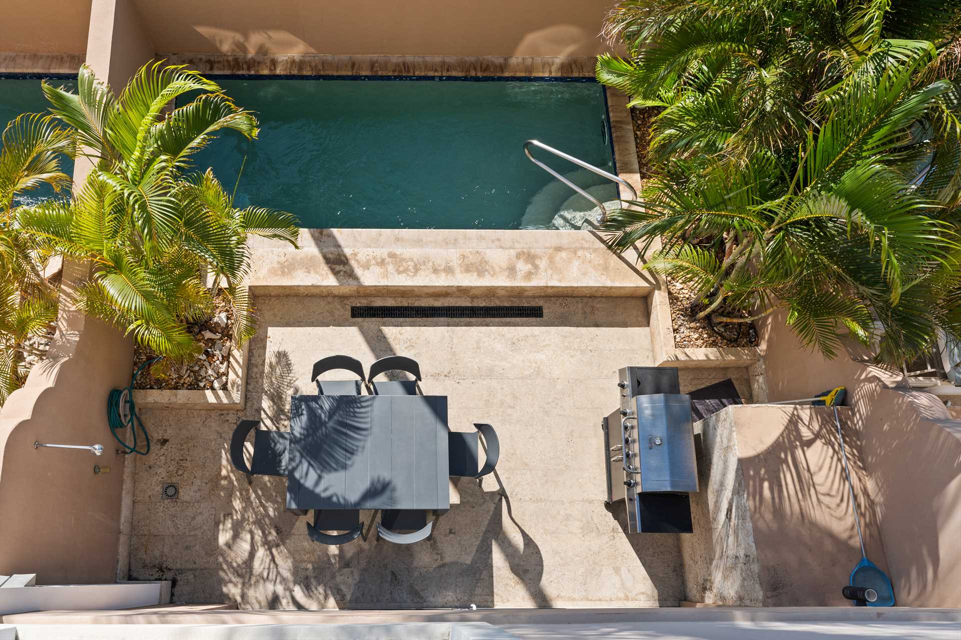 Private pool patio with outdoor dining and BBQ area at LeVent Townhouse 13, Eagle Beach Aruba