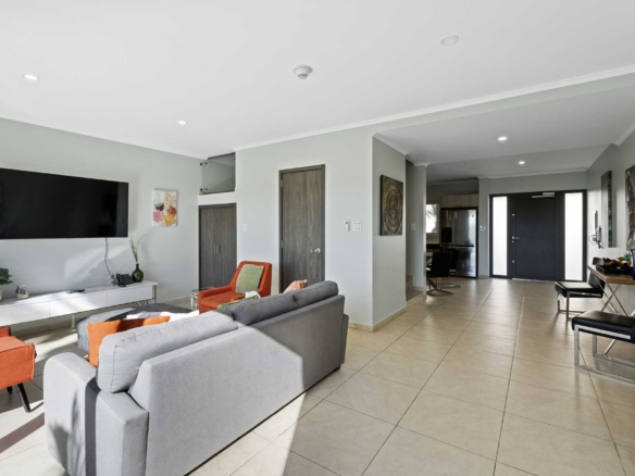 Open living area and entryway inside LeVent Townhouse 13 near Eagle Beach, Aruba