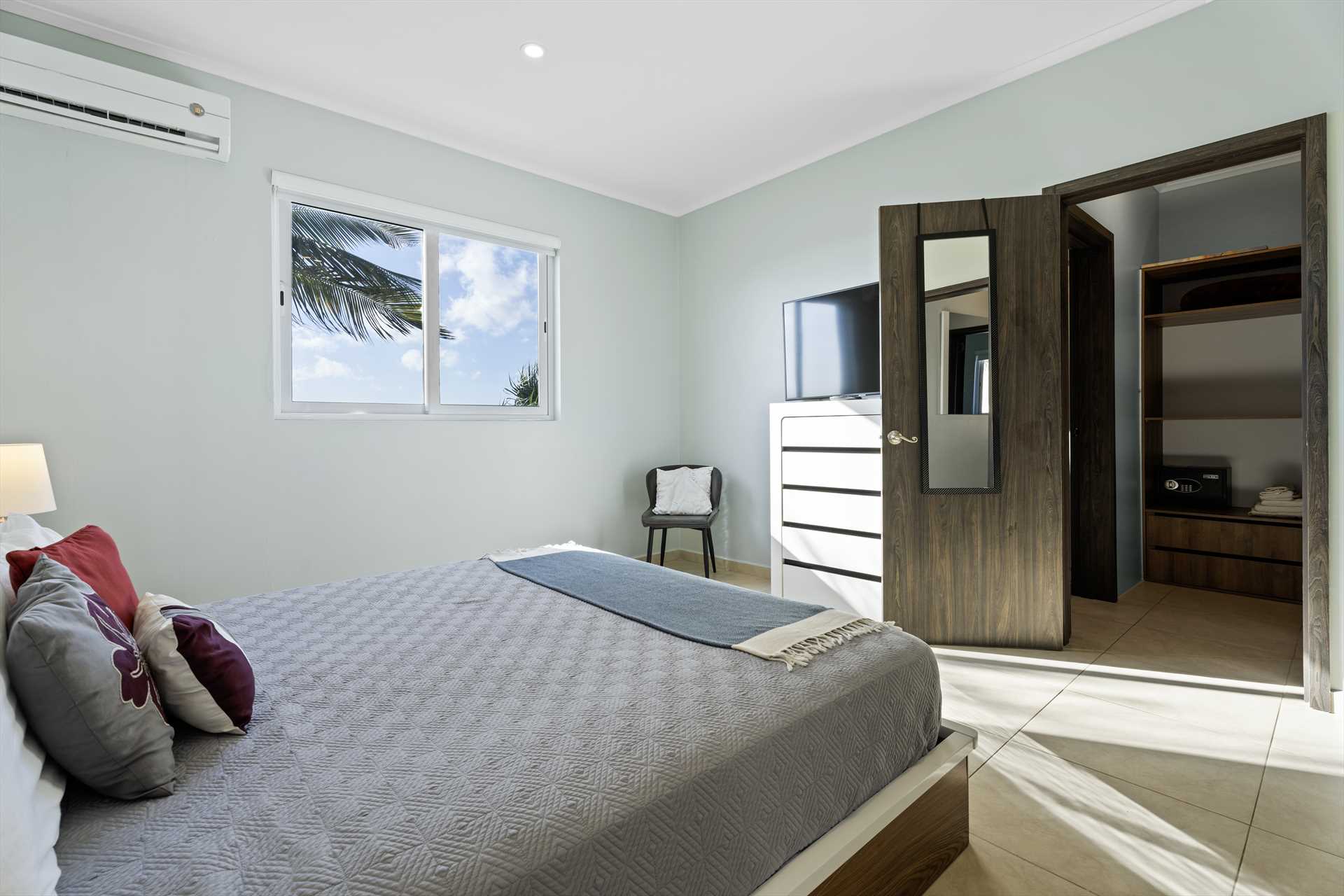 Primary bedroom suite with closet and furnishings at LeVent Townhouse 13, Eagle Beach Aruba