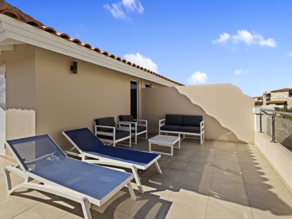 Private rooftop terrace with lounge seating at LeVent Townhouse 13, Eagle Beach Aruba