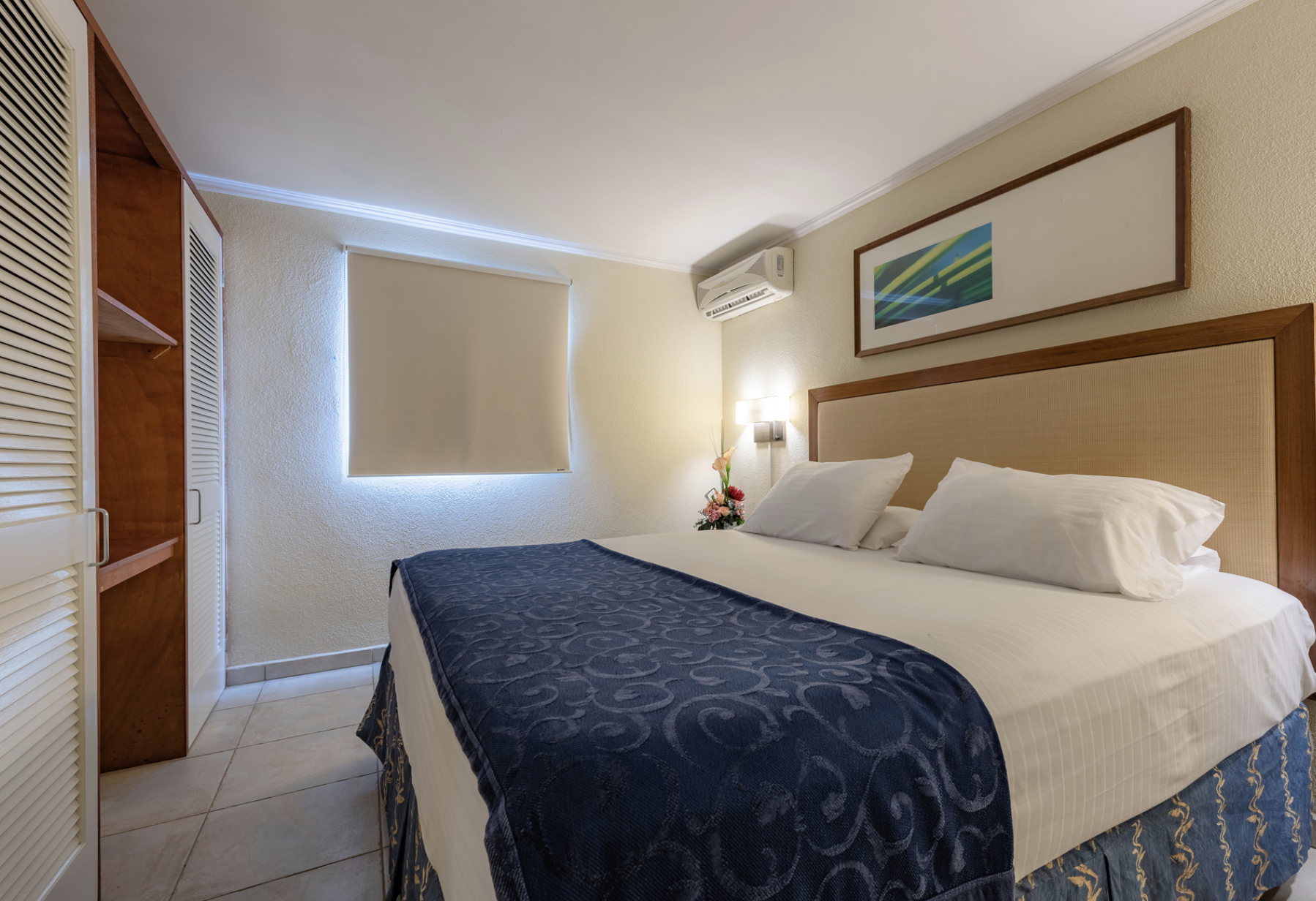 Furnished bedroom with air conditioning at Marquee Apartments in Noord, Aruba.