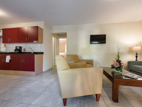 Furnished apartment living area with kitchen facilities at Marquee Apartments in Noord, Aruba.